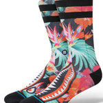 Stance Dorian Crew Cut Socks 2023 - A pair of crew socks with a tropical floral pattern in shades of pink, orange, and green on a black background.
