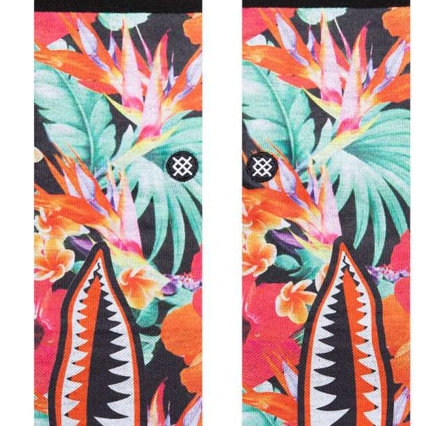 Stance Dorian Crew Cut Socks 2023 - A pair of crew cut socks with a tropical floral pattern in shades of pink, green, and orange on a black background.