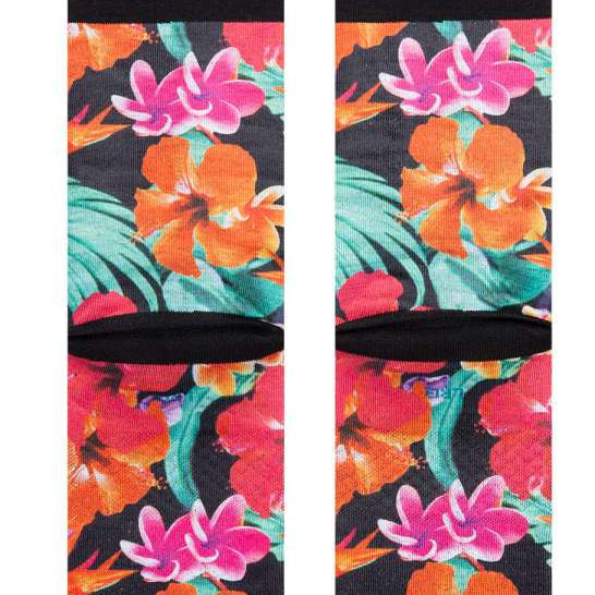 Stance Dorian Crew Cut Socks 2023 - A pair of crew cut socks with a tropical floral pattern in shades of pink, orange, and green on a black background.