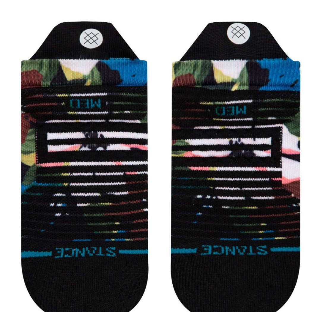 Stance Ladies Expanse Tab Low Cut Socks - A pair of low-cut socks with a multicolored abstract pattern featuring shades of pink, green, blue and yellow on a black background.