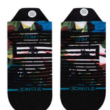 Stance Ladies Expanse Tab Low Cut Socks - A pair of low-cut socks with a multicolored abstract pattern featuring shades of pink, green, blue and yellow on a black background.