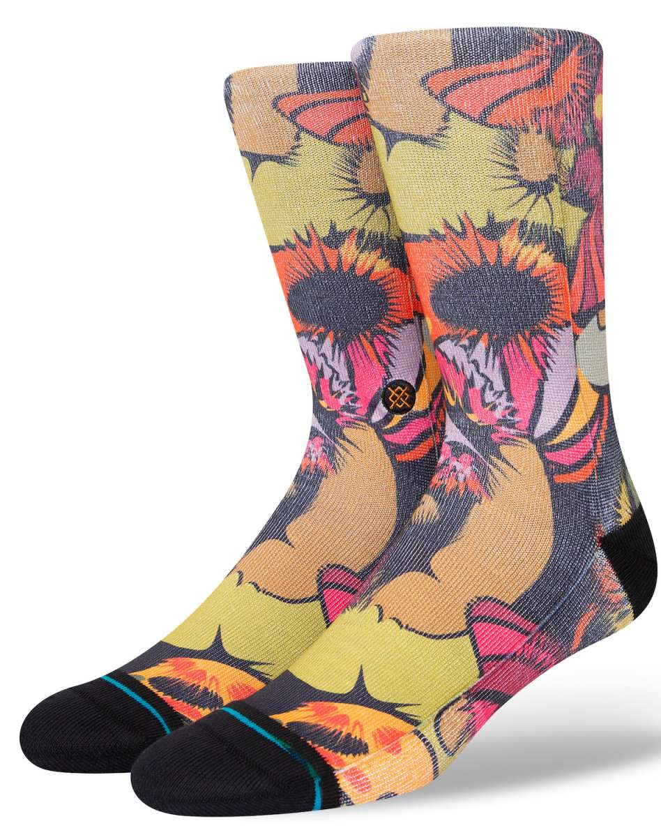 Stance Gooey Crew Socks 2023 - A pair of crew socks with a colorful, abstract design featuring shades of orange, pink, and yellow.