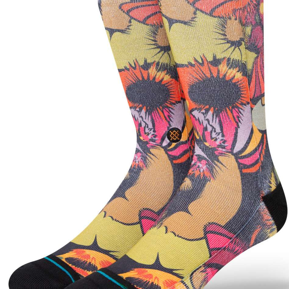 Stance Gooey Crew Socks 2023 - A pair of crew socks with a colorful, abstract design featuring shades of orange, pink, and yellow.