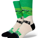 Stance Grogu West Crew Socks 2023 - Baby Yoda with green robes and hooded cloak on a tan background.