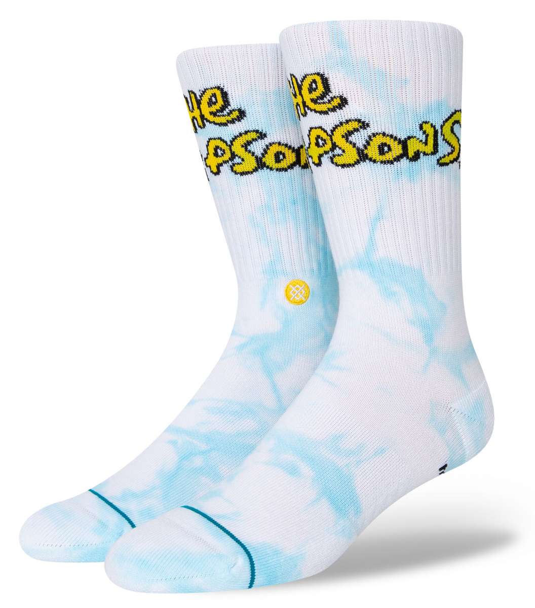 Stance Intro Crew Socks 2023 - White crew socks with black and yellow logo on top of foot.
