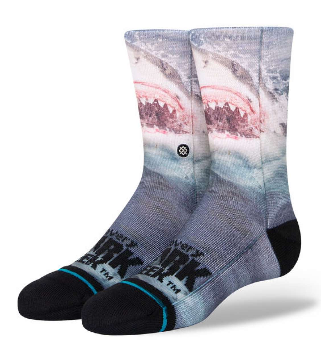 Stance Kids' Shark Week Crew Socks 2023 - A pair of crew socks with a shark design on them, featuring a pink and gray color scheme.