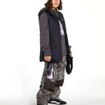 Volcom Women's Costus Pullover Fleece - A dark gray fleece pullover with a hood and zippered front, worn by a model on a light background.