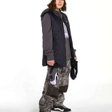 Volcom Women's Costus Pullover Fleece - A dark gray fleece pullover with a hood and zippered front, worn by a model on a light background.