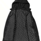 Volcom Field Insulated Flannel Jacket - A black flannel jacket with a hood, featuring a quilted pattern on the back and sleeves.
