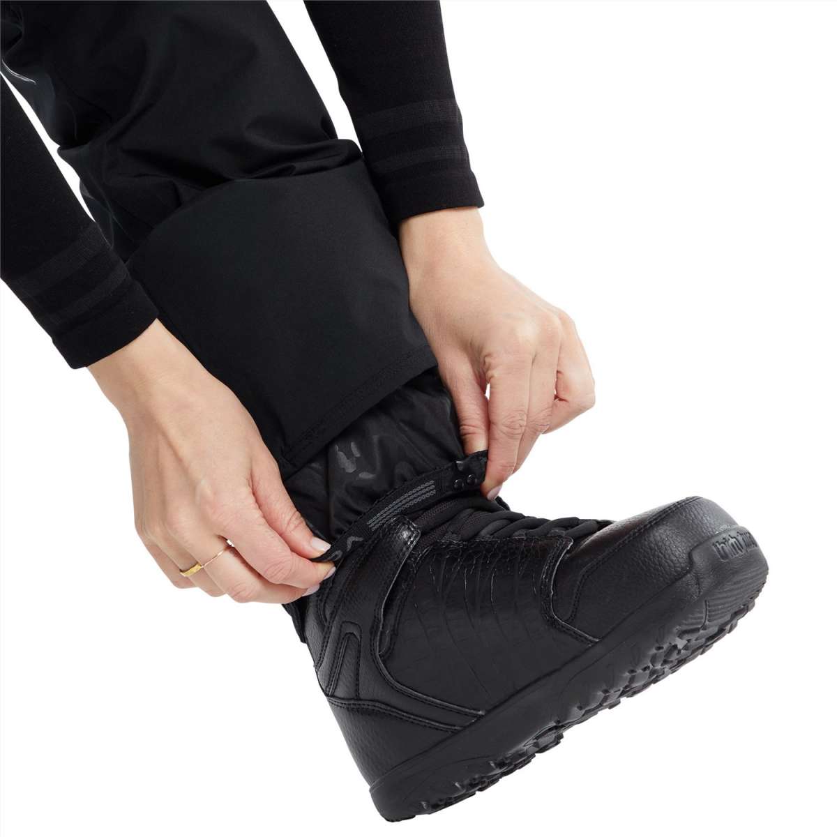 Volcom Women's Knox Insulated GORE-TEX Pant - A pair of black insulated ski pants with a zippered pocket on the thigh and a white logo on the left leg.