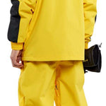 Volcom Longo GORE-TEX Shell Jacket - A bright yellow jacket with black accents and a hood, featuring a zippered chest pocket on the left side.