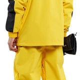 Volcom Longo GORE-TEX Shell Jacket - A bright yellow jacket with black accents and a hood, featuring a zippered chest pocket on the left side.