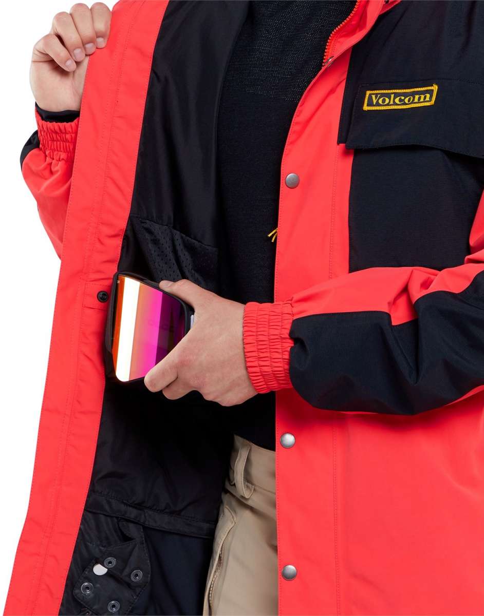 Volcom Longo GORE-TEX Shell Jacket 2024 - A black jacket with a yellow logo on the left chest and silver snaps down the front.