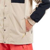 Volcom Longo GORE-TEX Shell Jacket 2024 - A tan jacket with a black chest pocket and silver snap buttons.