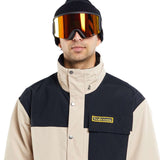 Volcom Longo GORE-TEX Shell Jacket 2024 - A black and tan jacket with a high collar, featuring a small logo on the chest pocket.