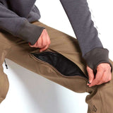 Volcom Women's Species Stretch Pant 2022 - A pair of khaki-colored pants with a zippered fly and two front pockets.