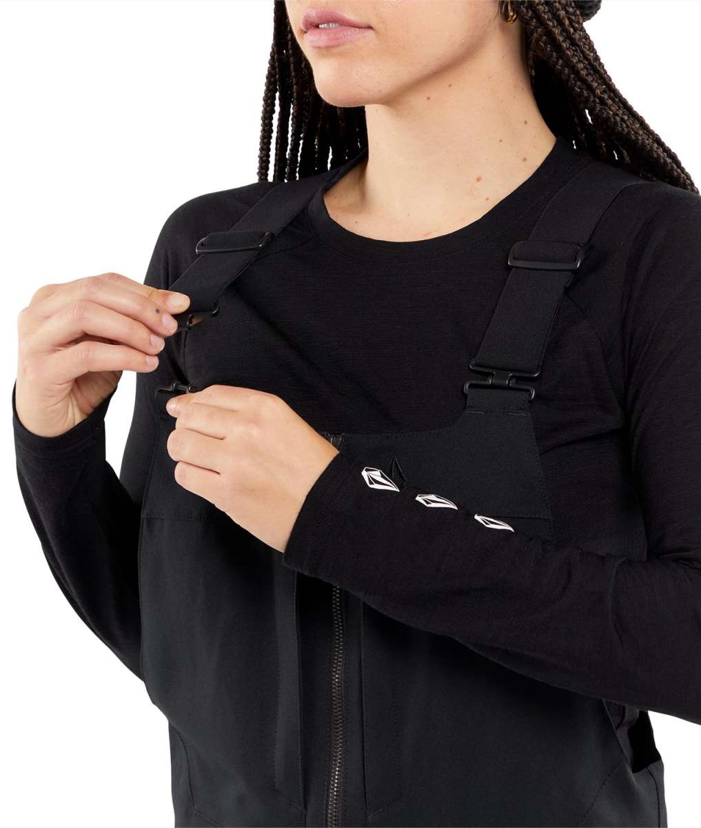 Volcom Women's Swift Bib Overall Pant - Black bib overalls with white logo on left thigh and black straps.