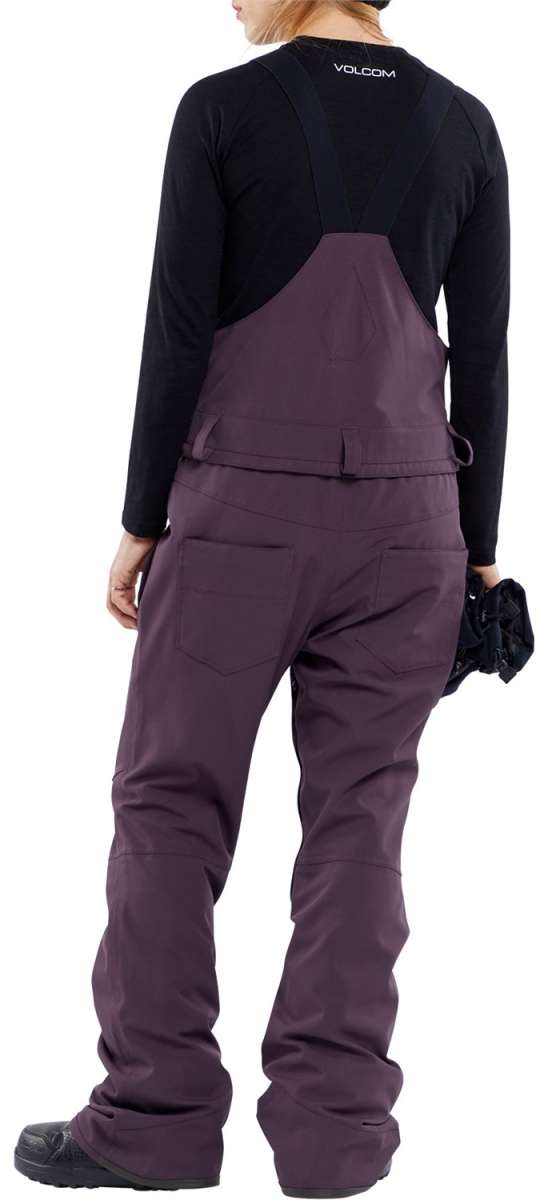 Volcom Women's Swift Bib Overall Pant - A pair of bib overalls in a solid black color with adjustable straps and multiple pockets.