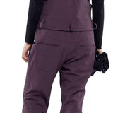 Volcom Women's Swift Bib Overall Pant - A pair of bib overalls in a solid black color with adjustable straps and multiple pockets.