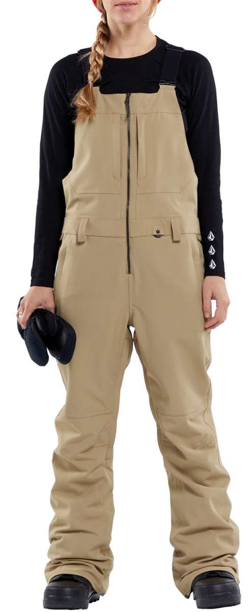 Volcom Women's Swift Bib Overall Pant - Tan bib overalls with zippered front and adjustable straps.