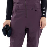Volcom Women's Swift Bib Overall Pant - A pair of purple snow pants with a bib design and adjustable straps.