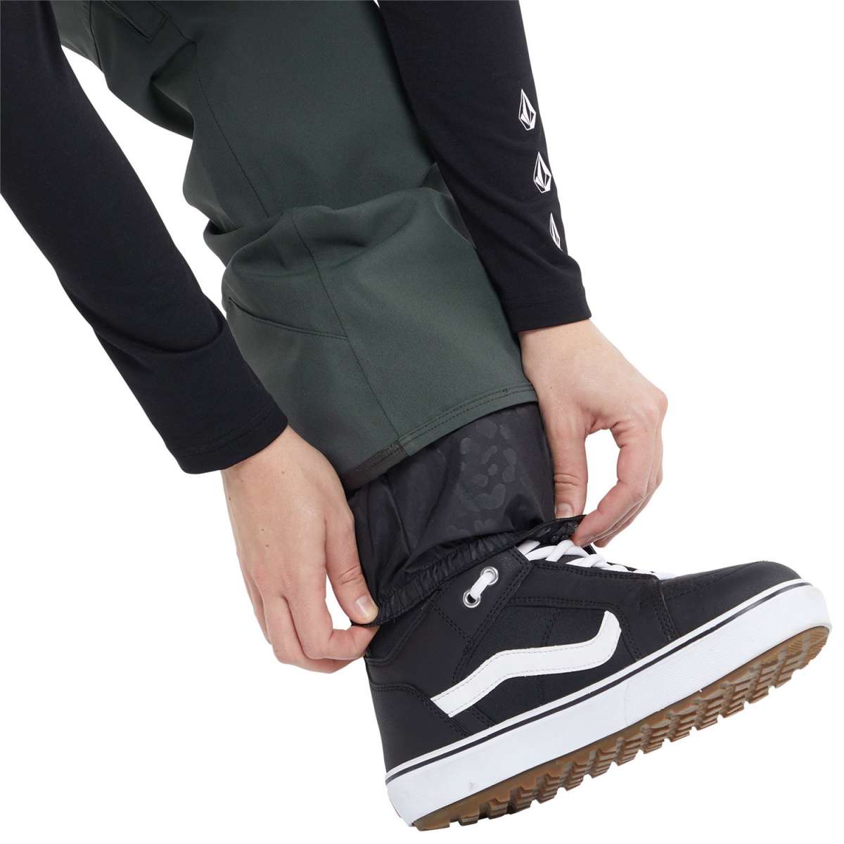 Volcom Women's Swift Bib Overall Pant 2024 - Black bib overalls with white logo on left thigh and black zipper fly.