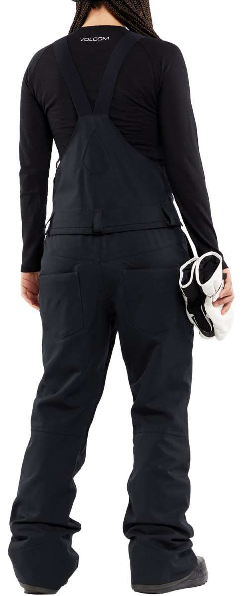 Volcom Women's Swift Bib Overall Pant 2024 - Black bib overalls with white drawstring on waistband and zippered pockets.