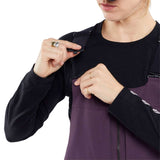 Volcom Women's Swift Bib Overall Pant 2024 - A pair of purple snowboard pants with a black zipper and adjustable straps.