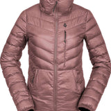 Volcom Women's Tia SD Jacket 2021 - A dusty rose-colored down-filled jacket with diagonal quilting and a high collar, featuring black zippers and a small logo on the chest.