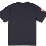 Volcom True To This USST Short Sleeve Tee 2022 - A dark gray t-shirt with a small red and white striped patch on the left sleeve.