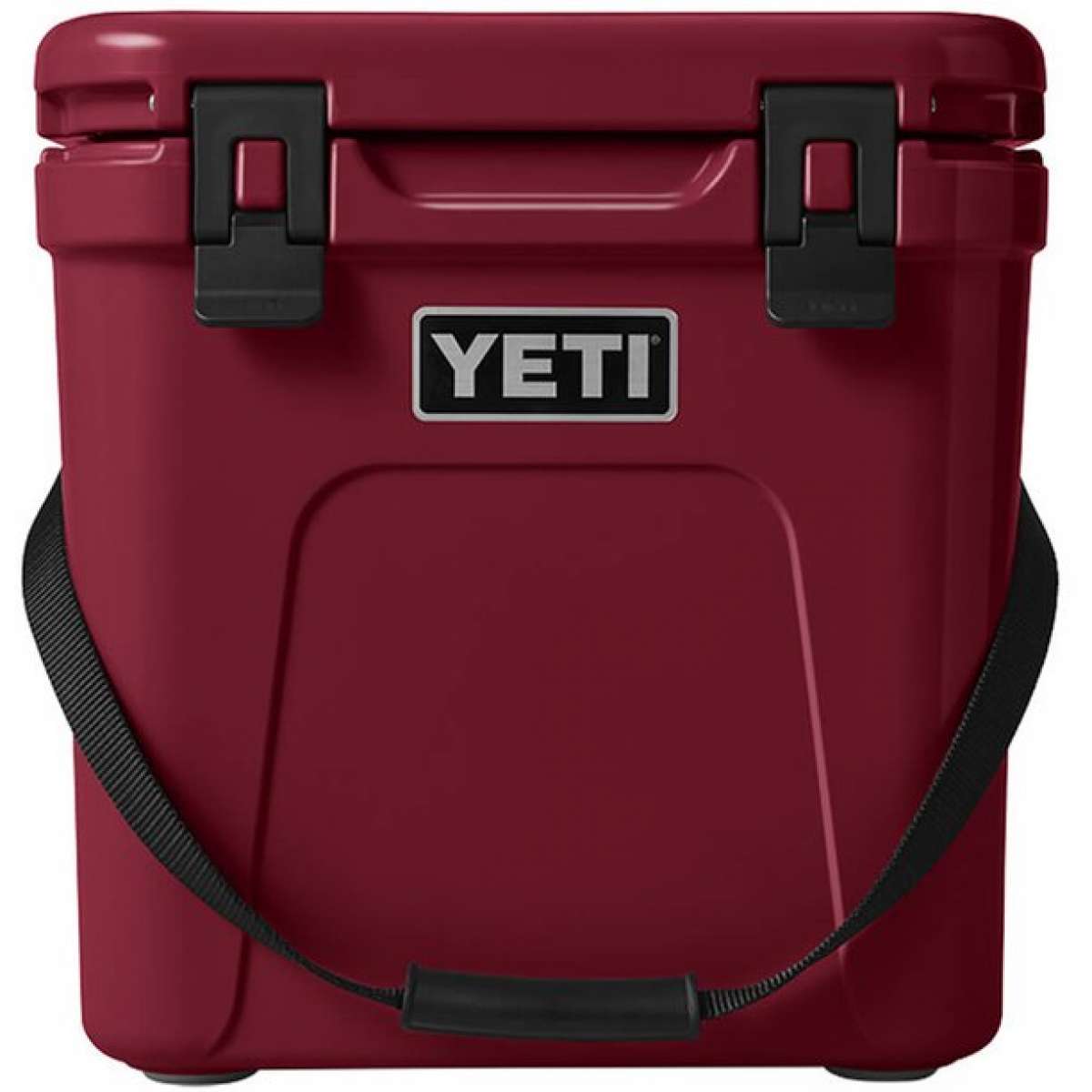 Yeti Roadie 24 Hard Cooler - A red cooler with a handle on top and two latches on the front.
