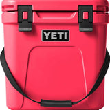 Yeti Roadie 24 Hard Cooler - A red cooler with a handle on top and two latches on the front.