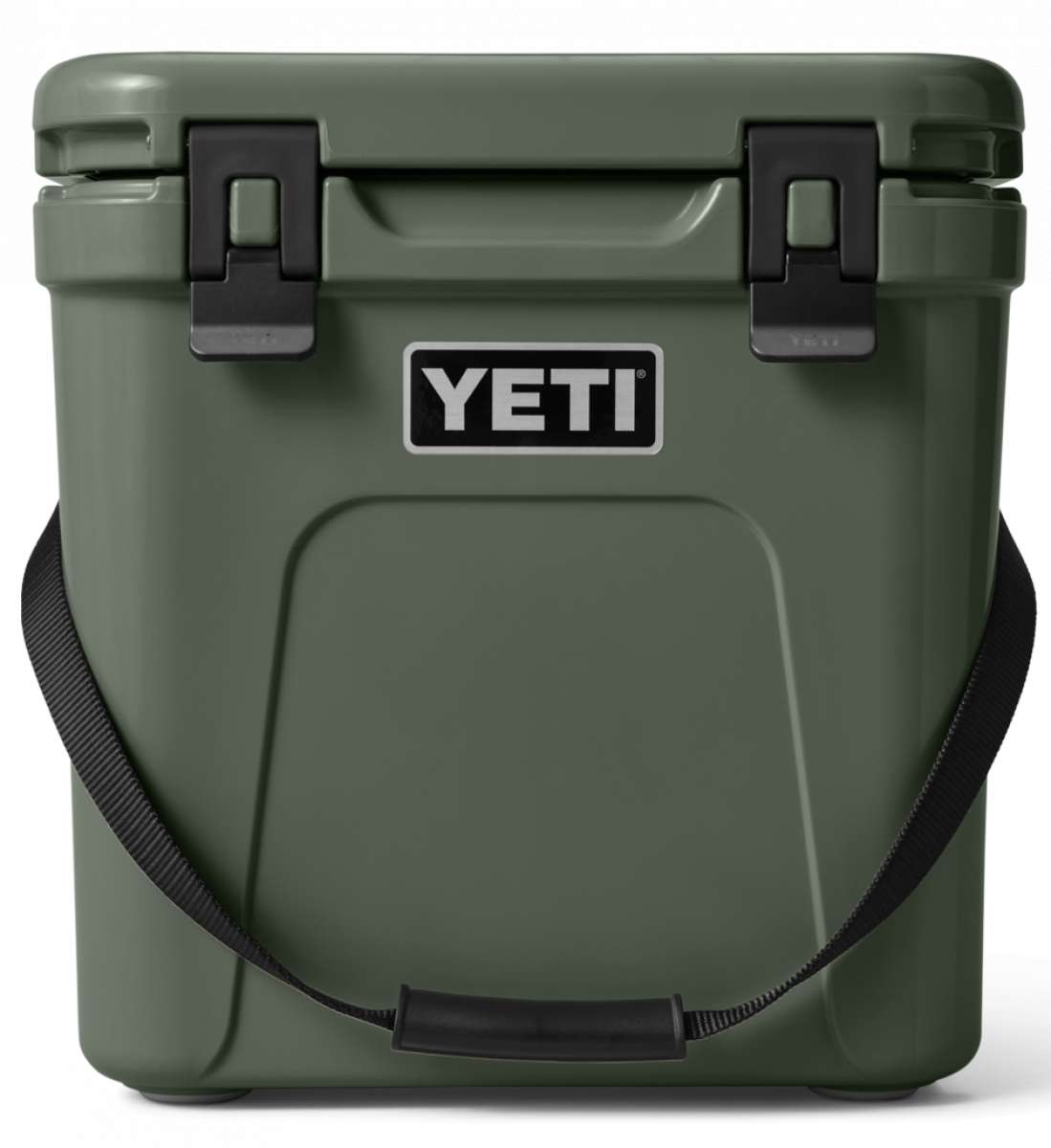 Yeti Roadie 24 Hard Cooler - A dark green cooler with a handle on top and two latches on either side of it.