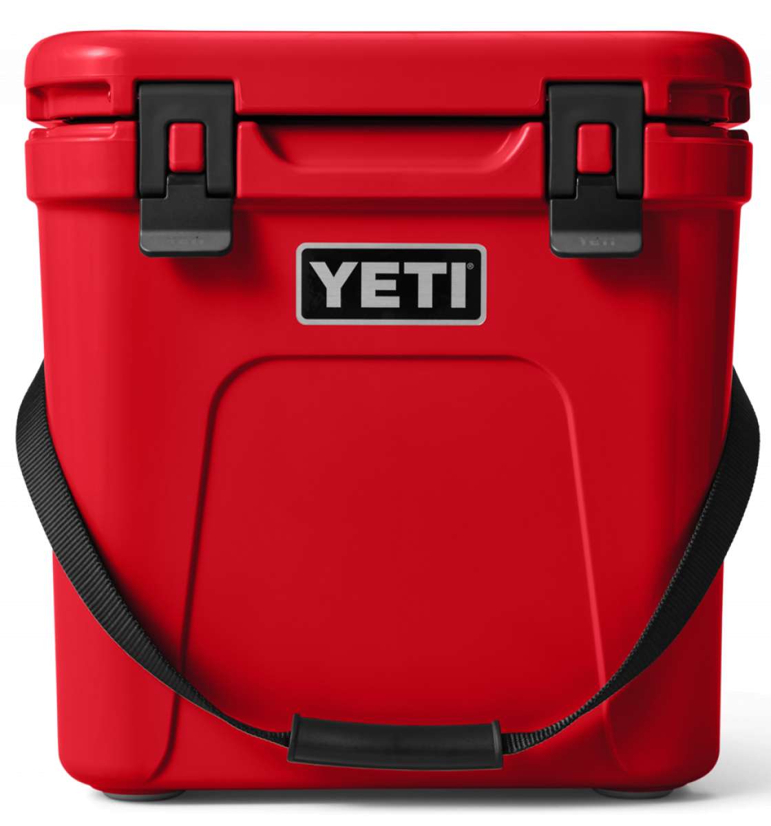 Yeti Roadie 24 Hard Cooler - A red cooler with a handle on top and two latches on the front.