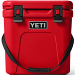Yeti Roadie 24 Hard Cooler - A red cooler with a handle on top and two latches on the front.