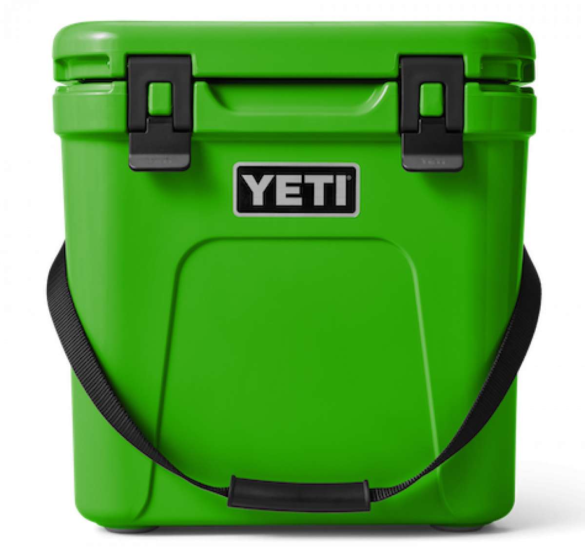 Yeti Roadie 24 Hard Cooler - A green cooler with a handle on top and two latches on the front.