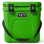 Yeti Roadie 24 Hard Cooler - A green cooler with a handle on top and two latches on the front.