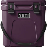 Yeti Roadie 24 Hard Cooler - A compact, portable cooler with a sleek design and a silver handle on top.