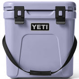 Yeti Roadie 24 Hard Cooler - A compact, portable cooler with a sleek design and a silver handle on top.