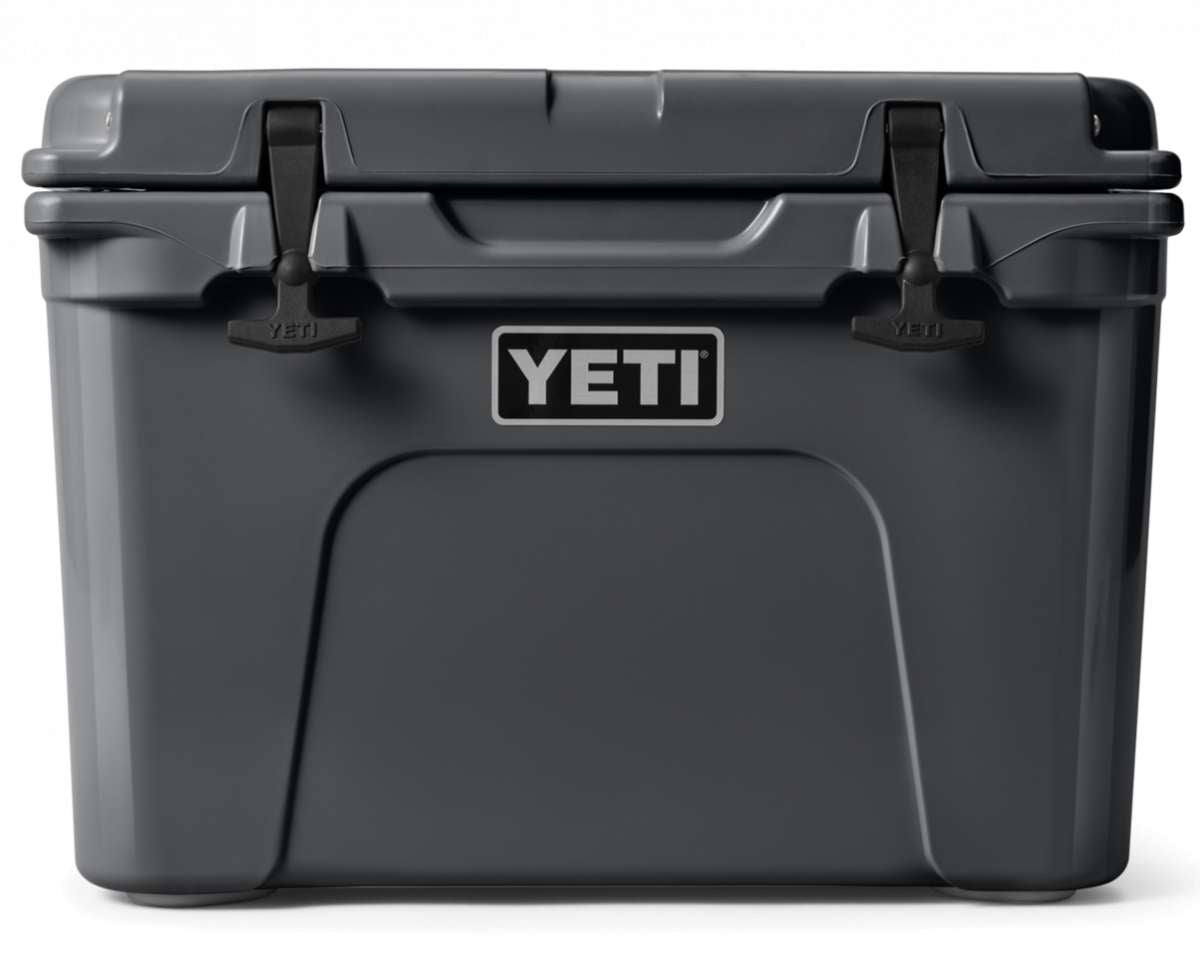 Yeti Tundra 35 Hard Cooler - A large, rectangular cooler with a dark gray lid and matching body, featuring a handle on top and a logo in silver lettering that reads "YETI" on the front.