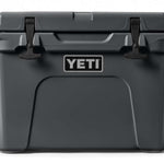 Yeti Tundra 35 Hard Cooler - A large, rectangular cooler with a dark gray lid and matching body, featuring a handle on top and a logo in silver lettering that reads "YETI" on the front.