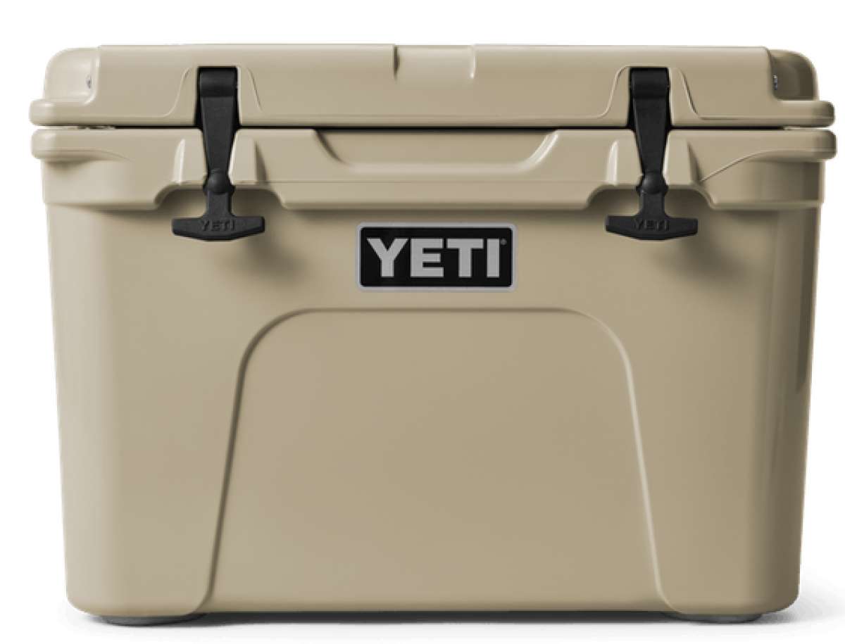 Yeti Tundra 35 Hard Cooler - A tan-colored cooler with a handle on top and two latches in front.