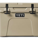 Yeti Tundra 35 Hard Cooler - A tan-colored cooler with a handle on top and two latches in front.