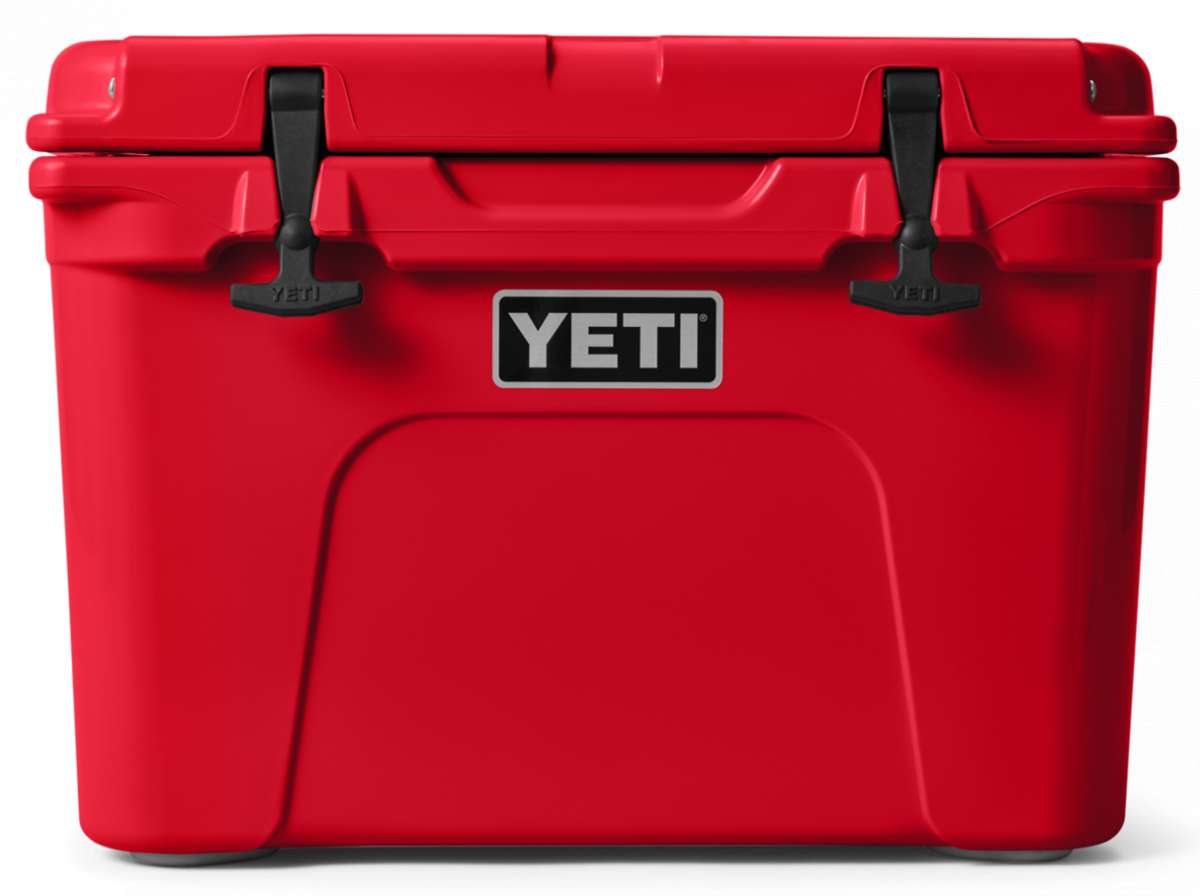 Yeti Tundra 35 Hard Cooler - A red cooler with a black handle on top and two latches in front.