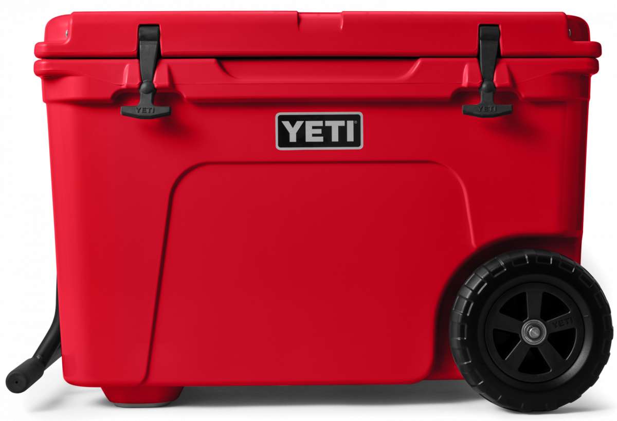Yeti Tundra Haul Wheeled Cooler - A large, red cooler with a handle and wheels on the bottom.