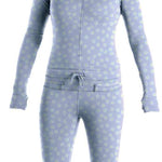 Airblaster Women's Classic Ninja Suit 2022 - A light blue snowsuit with a subtle floral pattern and a gold star on the chest.