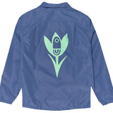 Airblaster Bruiser Shell Jacket 2024 - A blue jacket with a large graphic of a cartoonish, smiling face on the back.