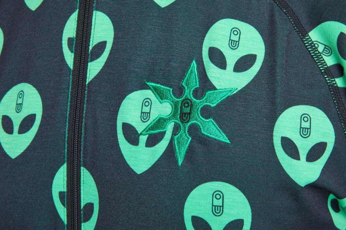 Airblaster Classic Ninja Suit 2022 - Black ninja suit with a repeating pattern of green ninjas in various poses.