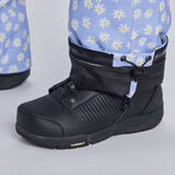 Airblaster Women's Freedom Insulated Suit 2024 - A light blue snowsuit with a repeating pattern of white daisies and yellow centers.