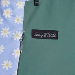 Airblaster Women's Freedom Insulated Suit 2024 - A light blue snowsuit with a repeating pattern of white flowers and yellow centers.